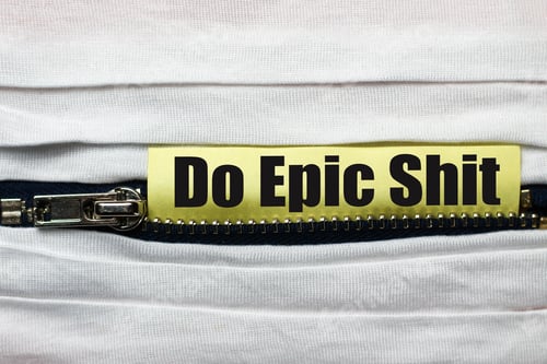Preview: White Fabric With Zipper Close-Up. Sticker With Text Or Caption: " Do Epic Shit"