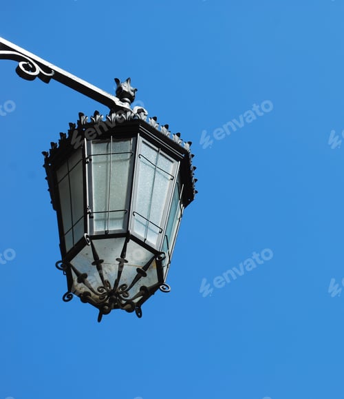 Preview: Old Vintage Lantern Against Blue Sky Background