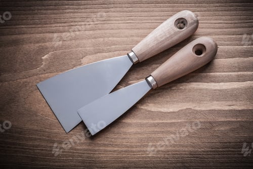 Preview: Two Putty Knifes With Wooden Handles.