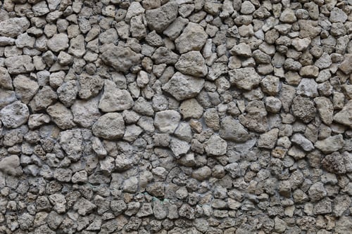 Preview: The Wall Is Made Of Decorative Wild Stone. Background Or Graphic Resource.