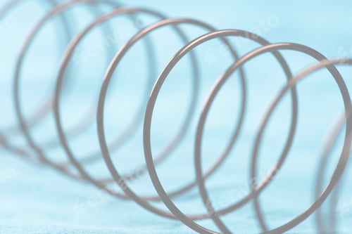 Preview: Details Of A Metal Spring On Blue Cloth.