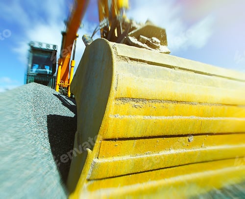 Preview: Excavator Against Blue Sky. Toned Image. Motion Blur Effect.