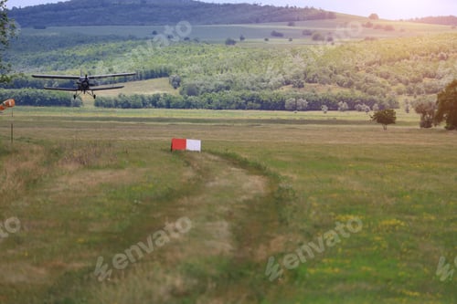 Preview: Classic Old Retro Vintage Airplane With Propeller Approach At The Airfield.