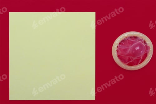 Preview: Unpacked Condom And Blank Sticker With Place For An Inscription Or Text On The Background Of An Old