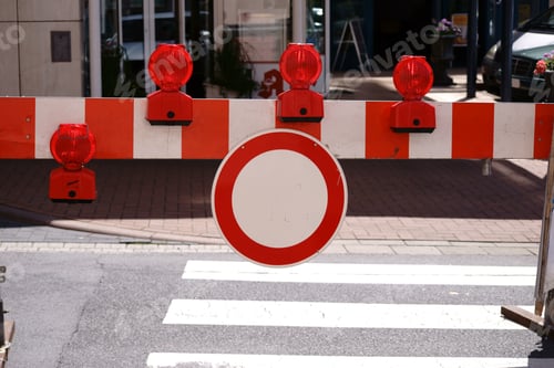 Preview: A Road Barrier With Signal Lights On A Pedestrian Crossing During A Street Festival.