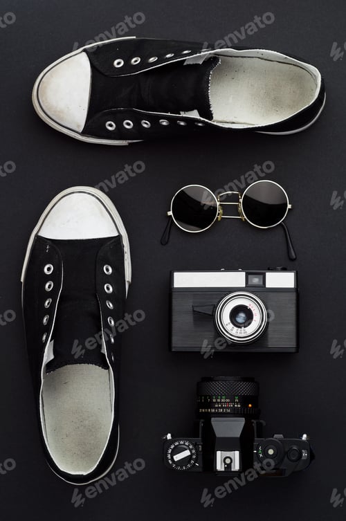 Preview: Concept: Ready For A Trip. Sneakers, Photo Camera, And Round Sunglasses Well Organized Over Black