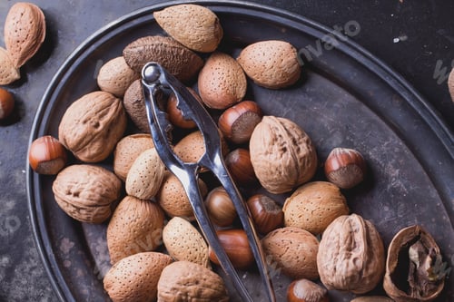 Preview: Selection Of Various Nuts: Almonds, Brazilian, Walnuts On A Vintage Oval Metal Tray, Black