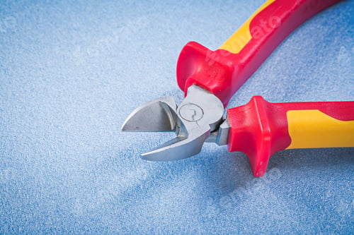 Preview: Cutting Pliers On Blue Background Electricity Concept.