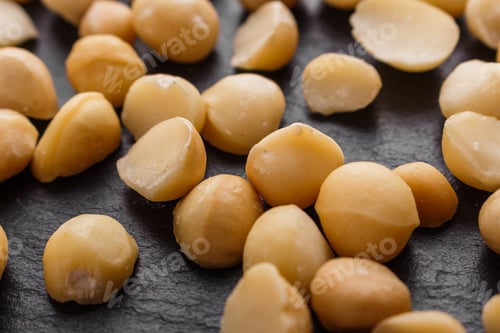 Preview: Delicious Macadamia Nuts On A Dark Stone Background