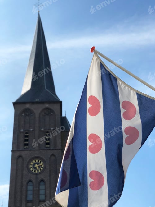 Preview: The Frisian Flag With The Sint Werenfriduskerk A Church In Workum, Friesland, The Netherlands