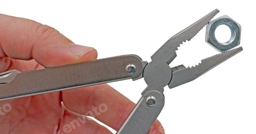 Preview: Hand Is Holding Universal Pliers On White Background