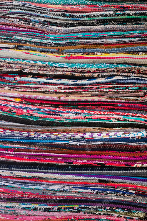 Preview: Colorful Background On Carpets Or Textile In The Colours Of The Rainbow Showing The Texture Of The