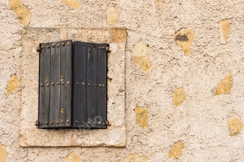 Preview: Vintage Wooden Window Shutters With Old Stone Wall Facade.