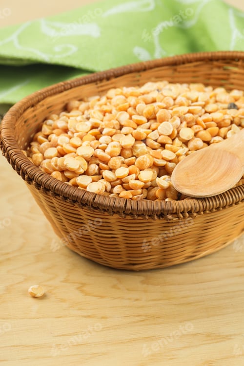 Preview: Dry Peas In Bucket On Wooden Background. Selective Focus.