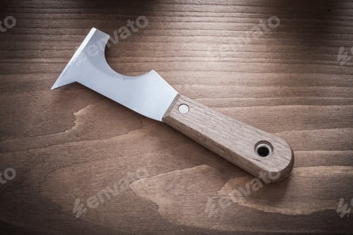 Preview: Stainless Putty Knife On Vintage Wooden Board Horizontal Version.