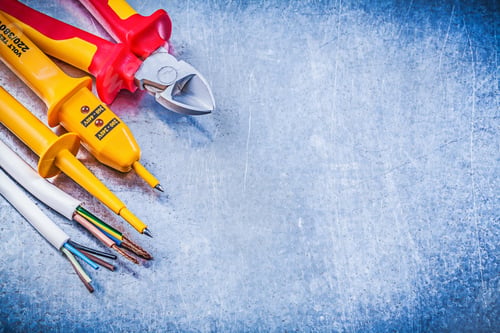 Preview: Yellow Electrical Tester Wires Nippers On Metallic Background Copy Space Electricity Concept.