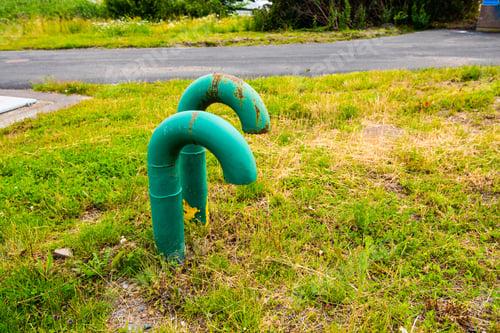 Preview: Two Green Vents Sticking Up Out Of The Ground