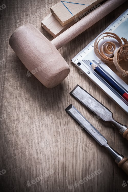 Preview: Wooden Bricks Hammer Curled Up Planning Chips Chisels Try Square Pencil On Wood Board Construction