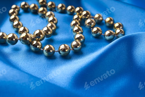 Preview: Christmas Necklace Against Blue Silk