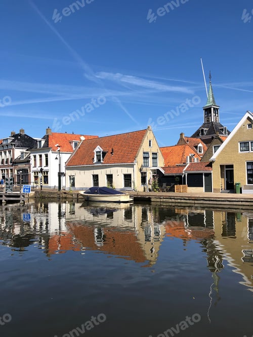 Preview: Houses Next To A Canal In The Old Town Of Makkum, Friesland, The Netherlands