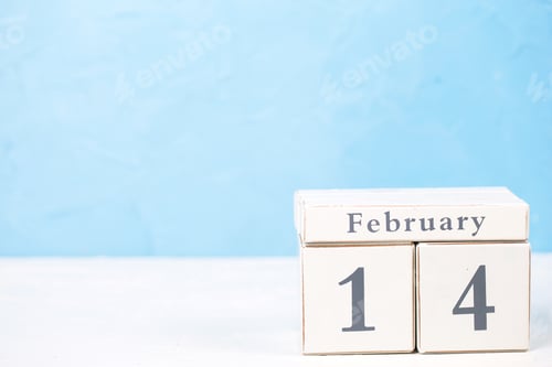 Aperçu: St. Valentine Day Background With Calendar On White Background Against Blue Wall. Selective Focus
