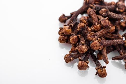 Preview: Fragrant Cloves On A White Acrylic Background