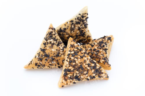 Preview: Crisps With Nuts And Seeds Stacked On A White Background.