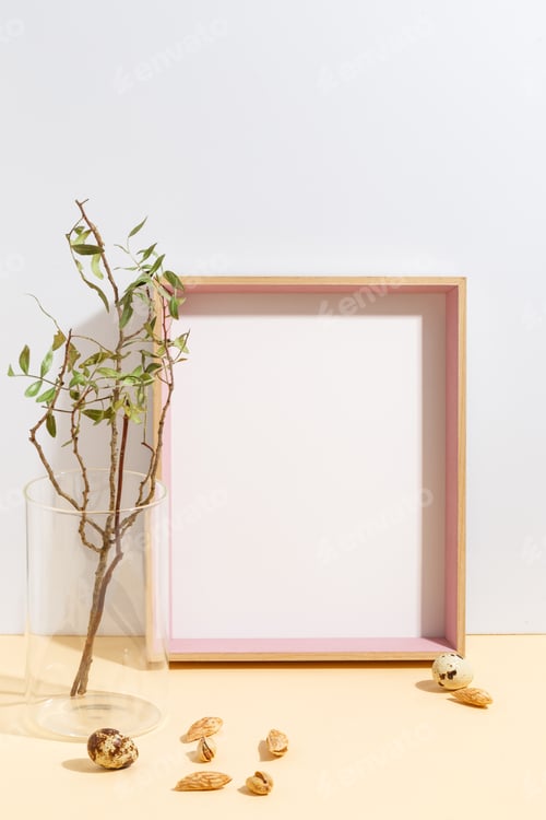 Preview: Mock Up White Frame And Branch With Green Leaves In Blue Vase On Book Shelf Or Desk. Minimalistic
