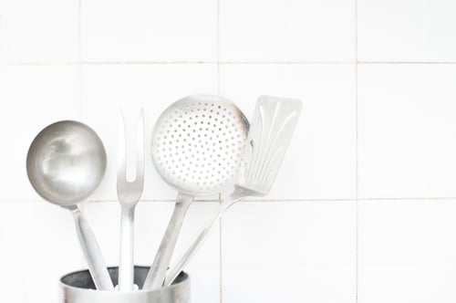 Preview: Close Up Of Various Steel Kitchenware On White Tile Wall