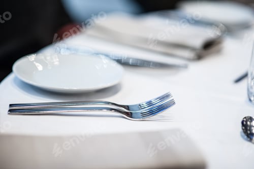 Preview: Cutlery And Plate On A Table In A Restaurant.