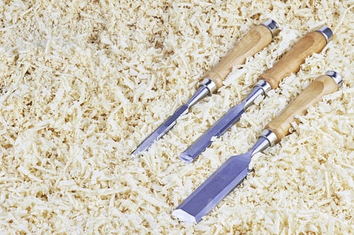 Preview: Three Chisels Of Various Widths Lying In Wooden Shavings