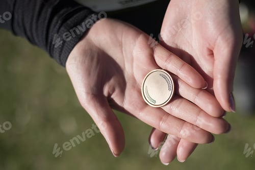 Preview: Young Woman Is Holding Medal In The Hands.