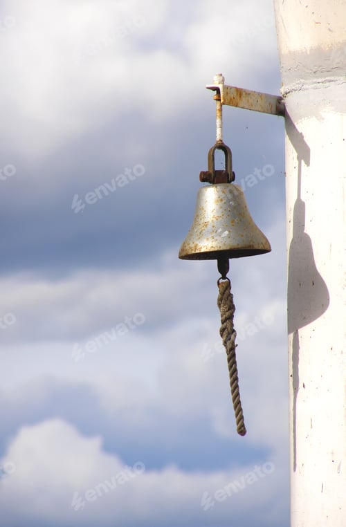 Preview: Ship'S Bell Against Background Of The Cloudy Sky