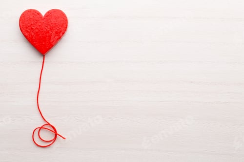 Preview: Happy Valentines Day. Red Ribbon Heart On A Wooden Background.
