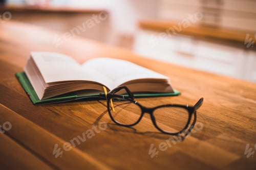 Preview: Open Book And Glasses On Table. Book And Glasses.