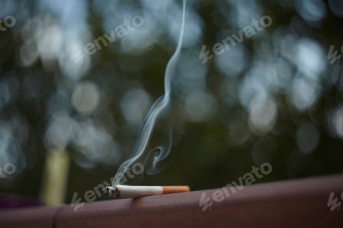 Preview: Macro Detail Of A Cigarette Left Lit And Forgotten On A Wall.