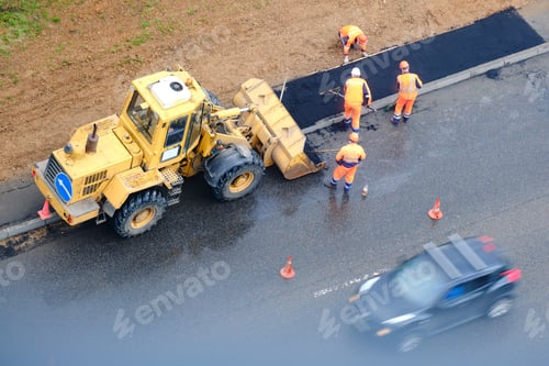 Preview: Asphalt A New On The Road And A Tractor On Laying Of Asphalt
