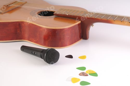 Preview: Guitar And Microphone On A White Background