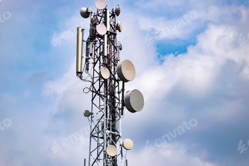 Preview: Telecom Tower With Lots Of Aerials And Antennas Mounted On It Against Cloudy Sky Background