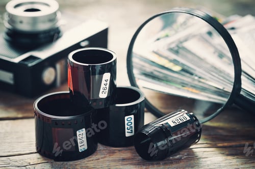 Preview: Photo Film Rolls, Retro Camera, Stack Of Photos And Magnifier Closeup
