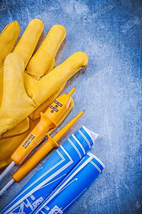 Preview: Yellow Electrical Tester Protective Gloves Blue Blueprints On Metallic Background.