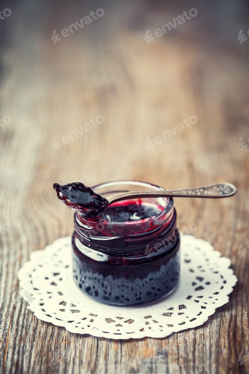 Preview: Jar Of Jam With Spoon On Old Wooden Table. Retro Toned.