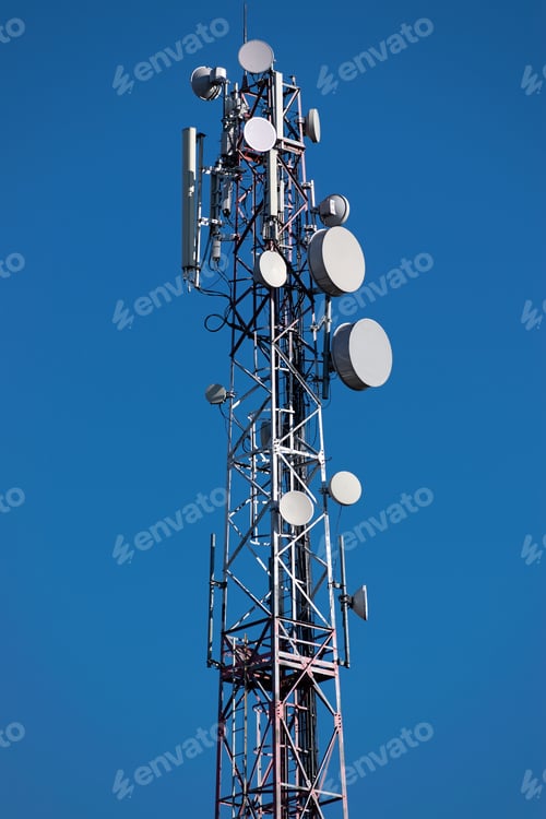 Preview: Gsm Tower With A Series Of Aerials On It Against Blue Sky On The Background