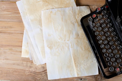 Preview: Vintage Typewriter and Aged Paper on Wood Surface