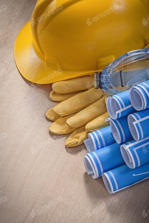 Preview: Composition Of Building Helmet Safety Gloves Glasses Blueprints On Wooden Board Construction