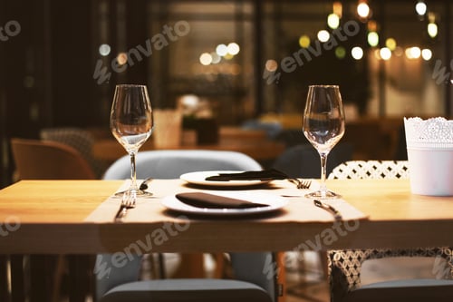 Preview: Served Table With Wine Glasses And Plates In A Restaurant, Romantic Evening