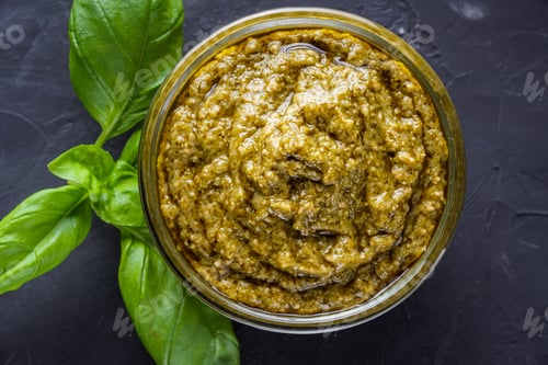 Preview: Delicious Traditional Italian Pesto Sauce On Dark Stone Background