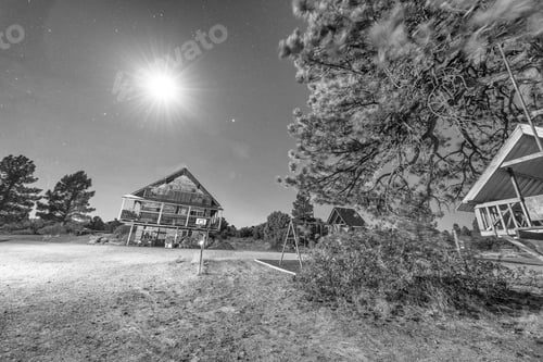 Preview: Mountain Wooden Homes With Night Sky. Stars And Bright Moon.