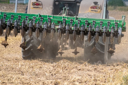 Preview: Yellow Tractor With The Cultivator Rear View Closeup