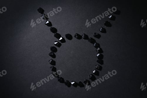Preview: Symbol Of The Zodiac Sign Taurus Made By Black Stones On A Black Background. Low Dark Key